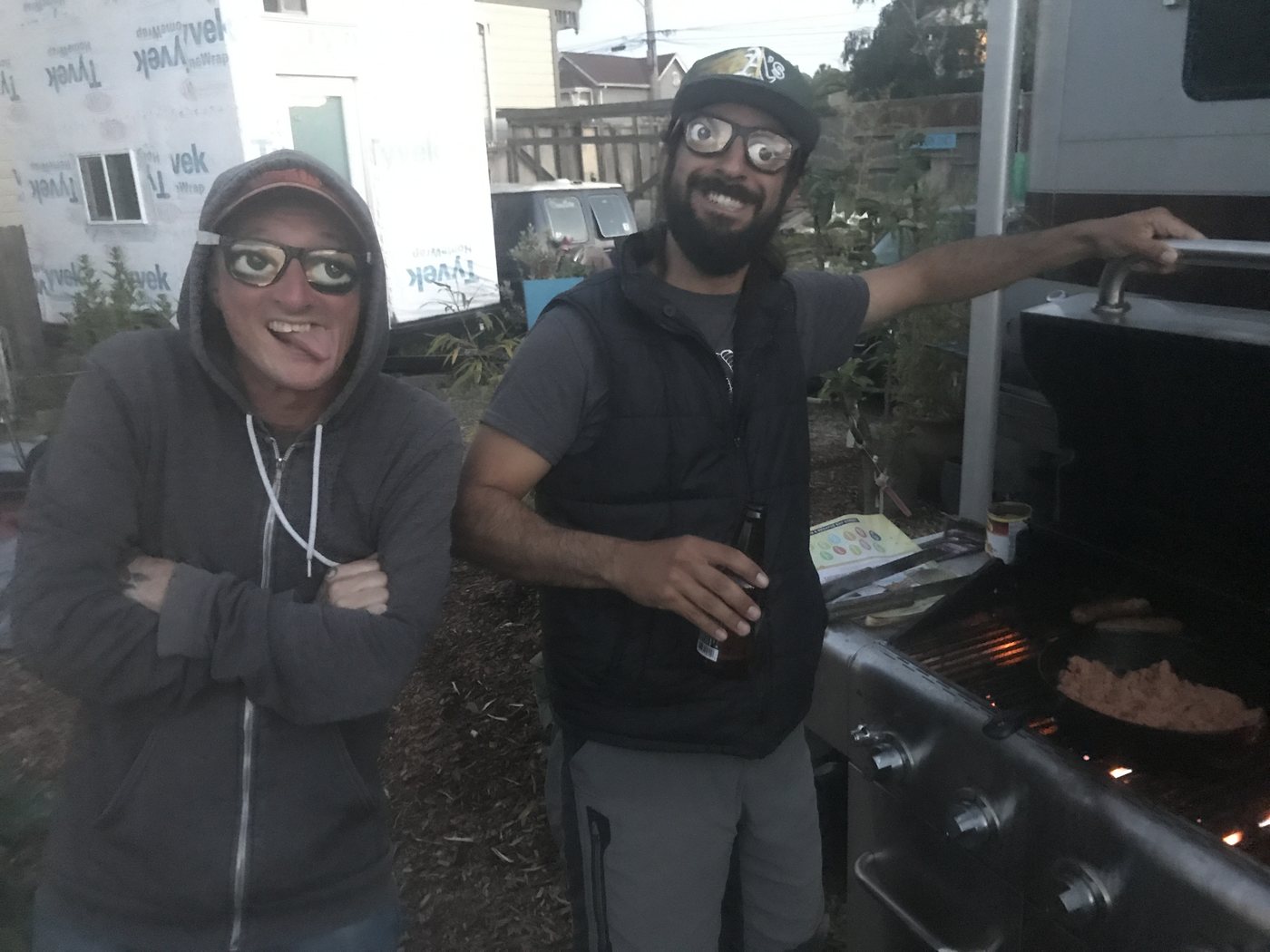 Two residents grilling dinner together