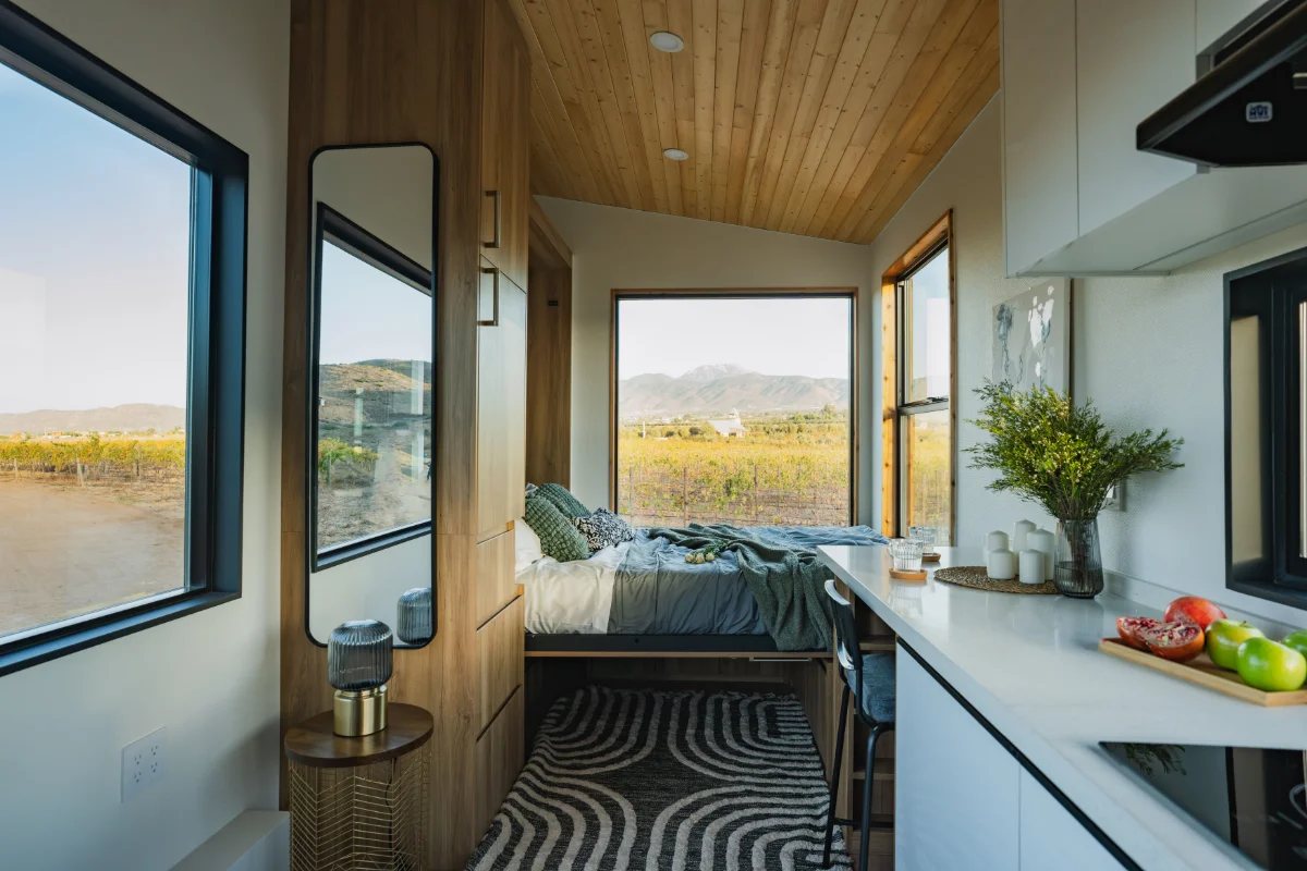 Sleeping area with windows looking onto open land